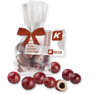 Schokolade, Johannisbeeren in weiß ca. 30g, Express Flachbeutel Maxi mit Schleife mit Werbekarte